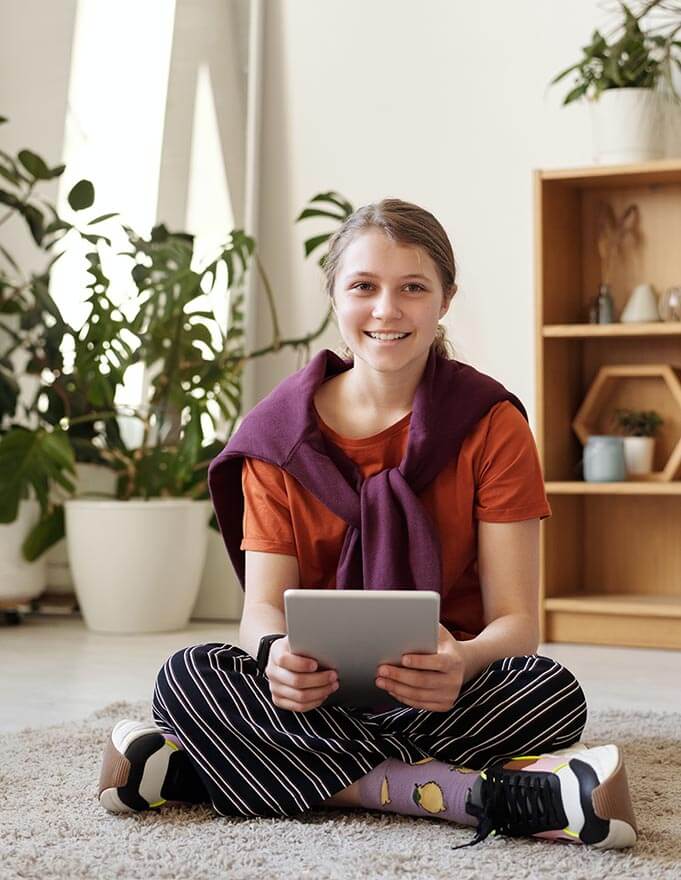 teen on an ipad